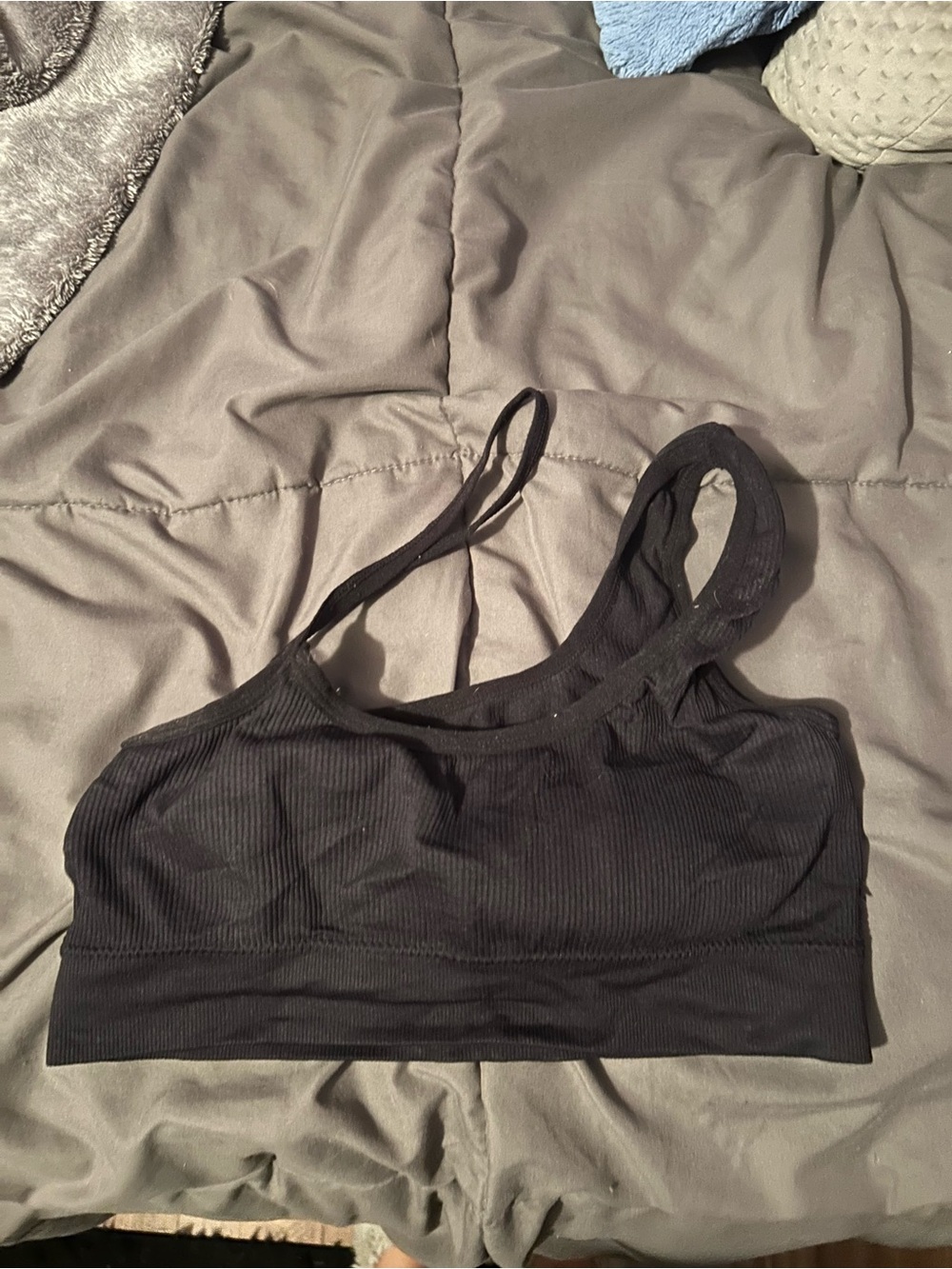 Black cross strap ribbed sports bra in size S. Polyester & elastane blend.